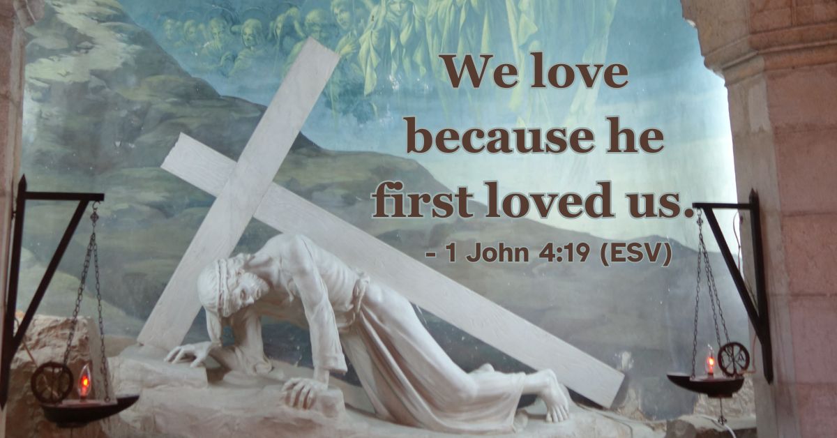 Bible verse from 1 John 4:19 about God's love coming first.